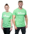 A man and a woman standing side by side smiling at the camera and wearing a green I Love Kickboxing t-shirt