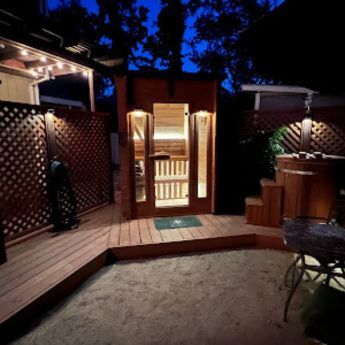 4 person backyard sauna at night