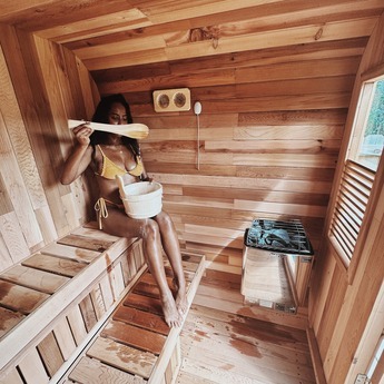 Lady Using her Cedar Cube Sauna