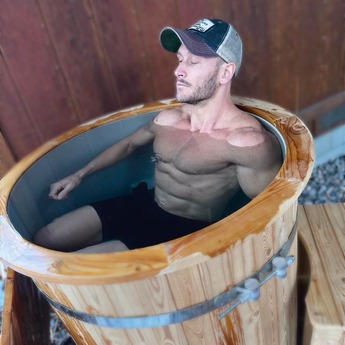 Man Relax in Redwood Outdoors Alaskan Cold Plunge