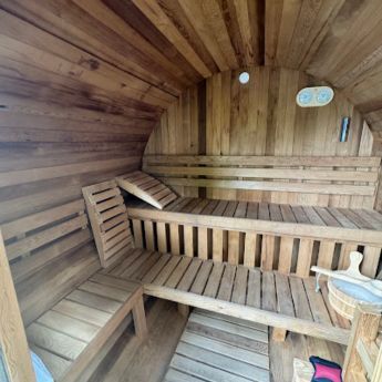 spacious outdoor traditional barrel sauna