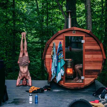 Men doing exercise outside of his Sauna