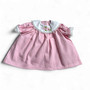 Ann Lauren Dolls® pink embroidered dress fits 18-inch baby dolls. Features a white Peter Pan collar with floral embroidery, lace trim, and puff sleeves.