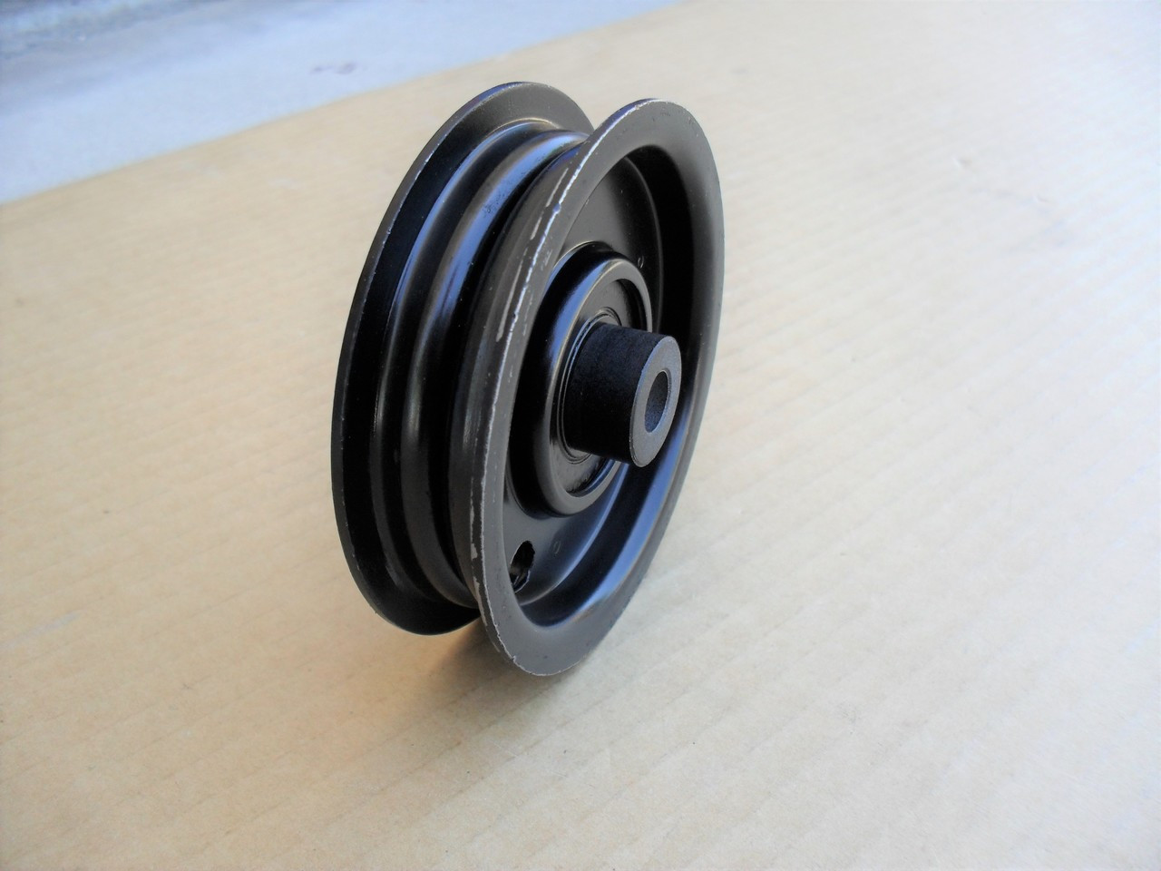 Flat Idler Pulley for AYP, Craftsman, Poulan LT125, LTH145, 123674X, 123688, 532123674 Height: 7/8" ID: 3/8" OD: 3-9/16" Made In USA