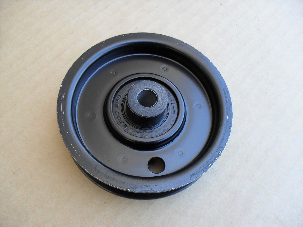 Flat Idler Pulley for AYP, Craftsman, Poulan LT125, LTH145, 123674X, 123688, 532123674 Height: 7/8" ID: 3/8" OD: 3-9/16" Made In USA