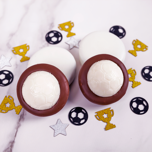 Milk chocolate covered Oreo with a white chocolate soccer ball on top.