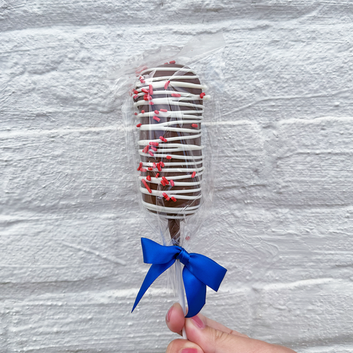 Chocolate-covered caramel marshmallow pop