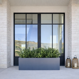 UV Outdoor Rated 26" Boxwood Bush in Urban Planter on a modern front porch