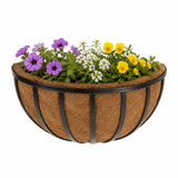 Wall Basket with Coco Liner at with purple, white, and yellow flowers