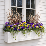 Solera Window Box with multi colored flowers and pussy willows installed under a window
