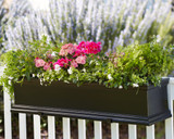 Black Fiberglass Laguna Window Box installed as railing planter with additional hardware.