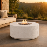 Basoa fire table shown with chalk finish on a deck at dusk with forested rolling hills in background