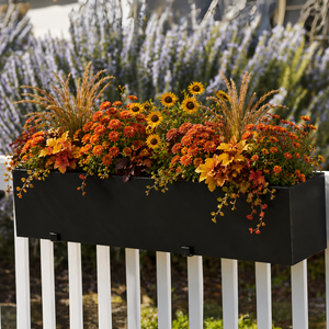 Modern Black Planter  with fall flowers on wood fence
