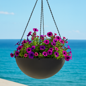 Black Fiberglass Hanging basket with ocean in background Black Fiberglass Hanging basket with ocean in background