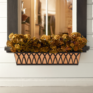 Arch tapered powder coated iron window box with fall flowers shown with copper liner Arch tapered powder coated iron window box with fall flowers shown with copper liner