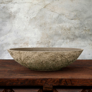 Primitive Low Bowl in Savoy Finish on wood table with gray background Primitive Low Bowl in Savoy Finish on wood table with gray background