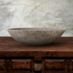 Turo Low Bowl in Rustico on wood table with gray background Turo Low Bowl in Rustico on wood table with gray background
