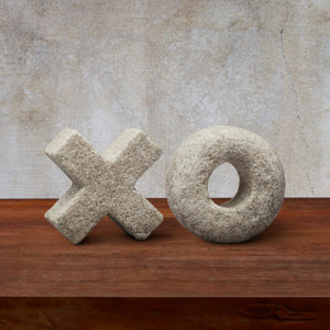 X and O Object finished in Chenza on wood table with gray background X and O Object finished in Chenza on wood table with gray background