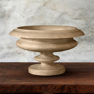 Cheju Urn in antigua finish on wood table with gray backround Cheju Urn in antigua finish on wood table with gray backround