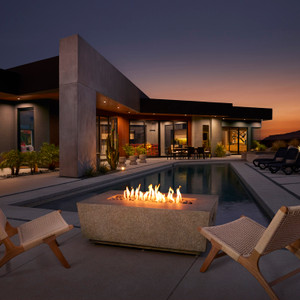 Rocher fire table shown in rustico at a modern desert house