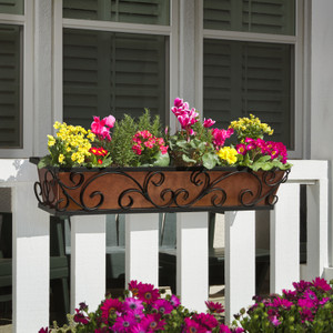 Regalia Railing Planter on white railing with yellow pink and red flowers Regalia Railing Planter on white railing with yellow pink and red flowers
