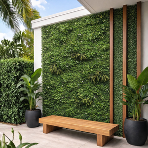 UV Outdoor Rated Lush Living Wall installed outside a modern home with a bench in front of it