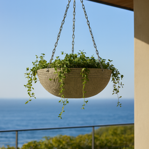 Zaragoza Fiberstone Hanging Basket with an ocean view behind it Zaragoza Fiberstone Hanging Basket with an ocean view behind it