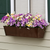 Oil Rubbed Bronze Galvanized 2-in-1 Window Box or Liner installed on window with spring flowers