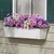 White Galvanized 2-in-1 Metal Tapered Window Box or Liner mounted under window with spring flowers