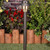 Centaurus Low Voltage Path Light - Weathered Brass in a garden
