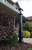 Sinclair Lamp Post in black by a home