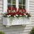 XL Hampton installed on a home with red and white flowers