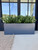 Urban fiberglass Rectangular planter in charcoal on a modern front porch