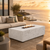 Coral Fire Table in chalk finish on deck with Pacific Ocean in background