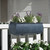 Barrel Fiberstone Railing Planter in zinc finish with white and purple flowers on a white railing