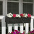 Falling Water Railing Planter on white railing planted with pink and white flowers