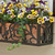 French Quarter Cast Aluminum Window Box with yellow flowers