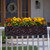 French Quarter Cast Aluminum Window Box with oil rubbed galvanized liner on railing with gold and orange flowers