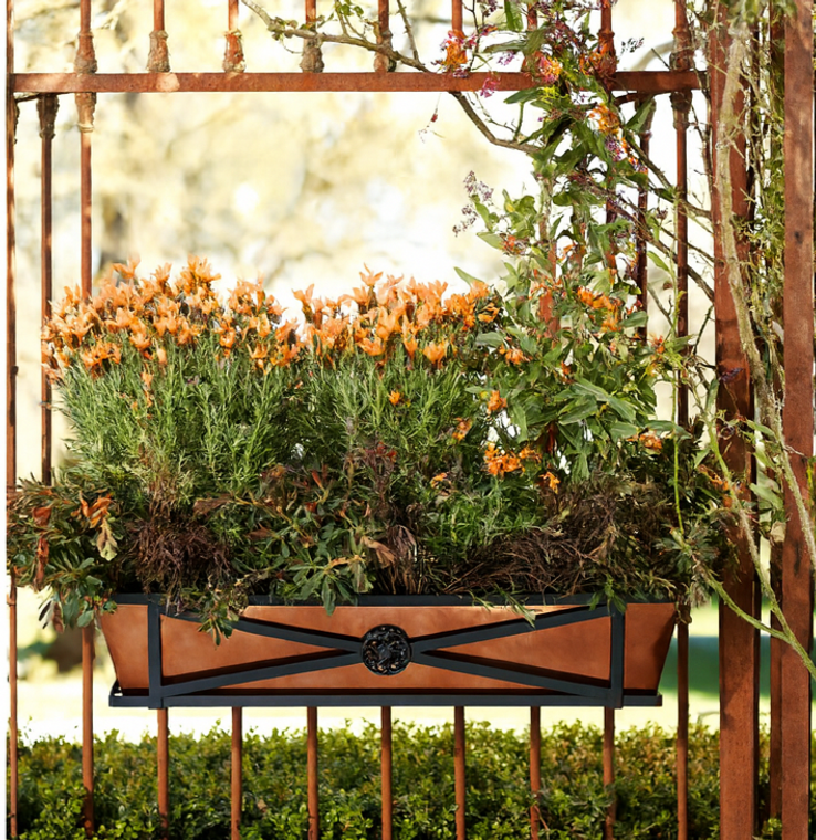 Medallion window box on a rail with bronze liner and orange flowers