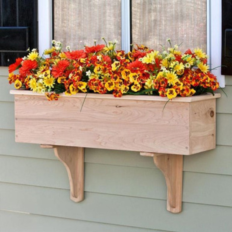 Traditional Cedar Wood Planter Box planted with orange flowers mounted to a home
