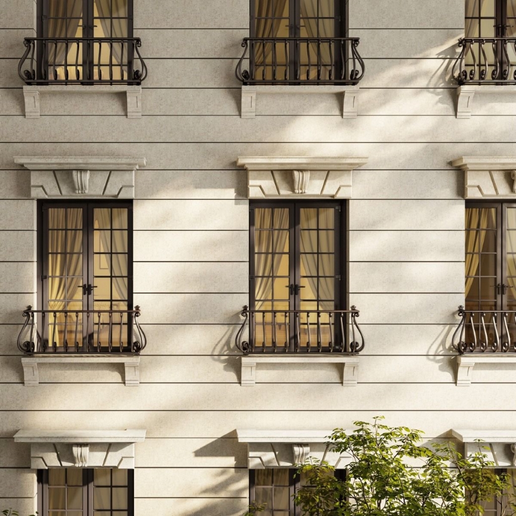 European faux balconies installed on the side of  an upscale hotel with French doors