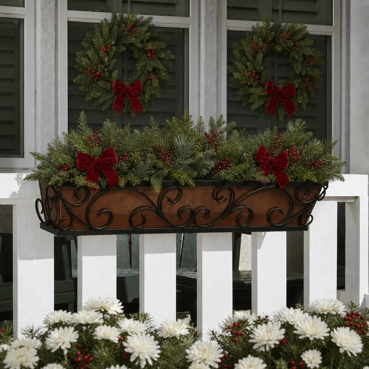 Regalia Window Box on a rail with Christmas greenery and bows.