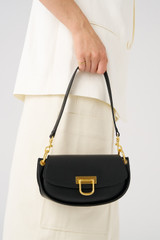 Profile view of model wearing the Oroton Colt Small Baguette in Black and Smooth leather for Women . IP:3