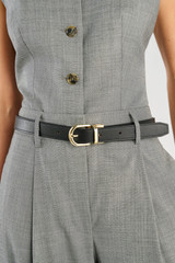 Profile view of model wearing the Oroton Inez Reversible Belt in Black/Cognac and Premium saffiano leather for Women .