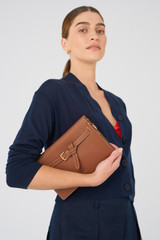 Profile view of model wearing the Oroton Margot Crossbody in Whiskey and Pebble leather for Women