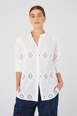 Profile view of model wearing the Oroton Diamond Lace Tunic in White and 100% Cotton for Women