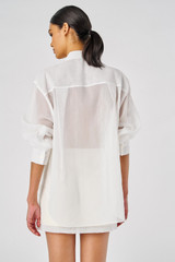 Profile view of model wearing the Oroton Lace Flower Sheer Overshirt in Antique White and 100% Cotton for Women
