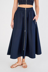 Profile view of model wearing the Oroton Zip Utility Midi Skirt in North Sea and 100% cotton for Women