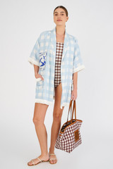 Profile view of model wearing the Oroton Patched Gingham Robe in Pale Blue and 100% linen for Women