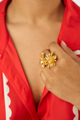 Profile view of model wearing the Oroton Peony Ring in Worn Gold and Brass for Women